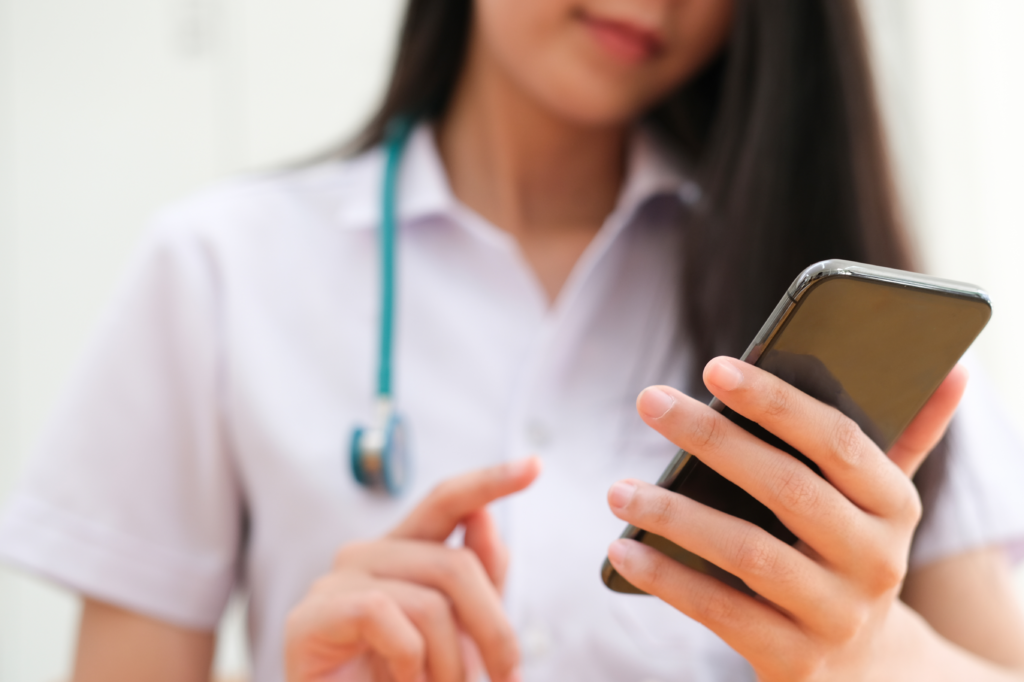 nurse uses a home care software with a mobile app